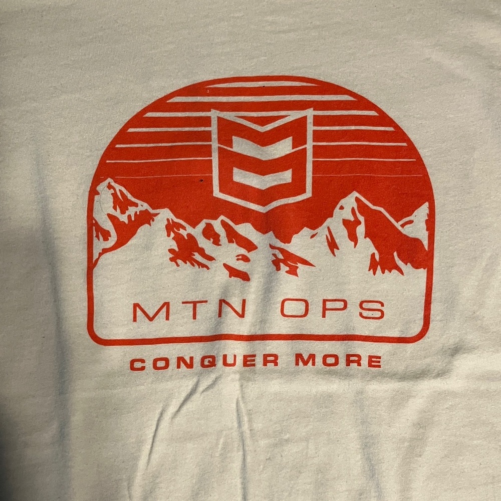 MTN OPS Cream Color T-Shirt with Orange Logo